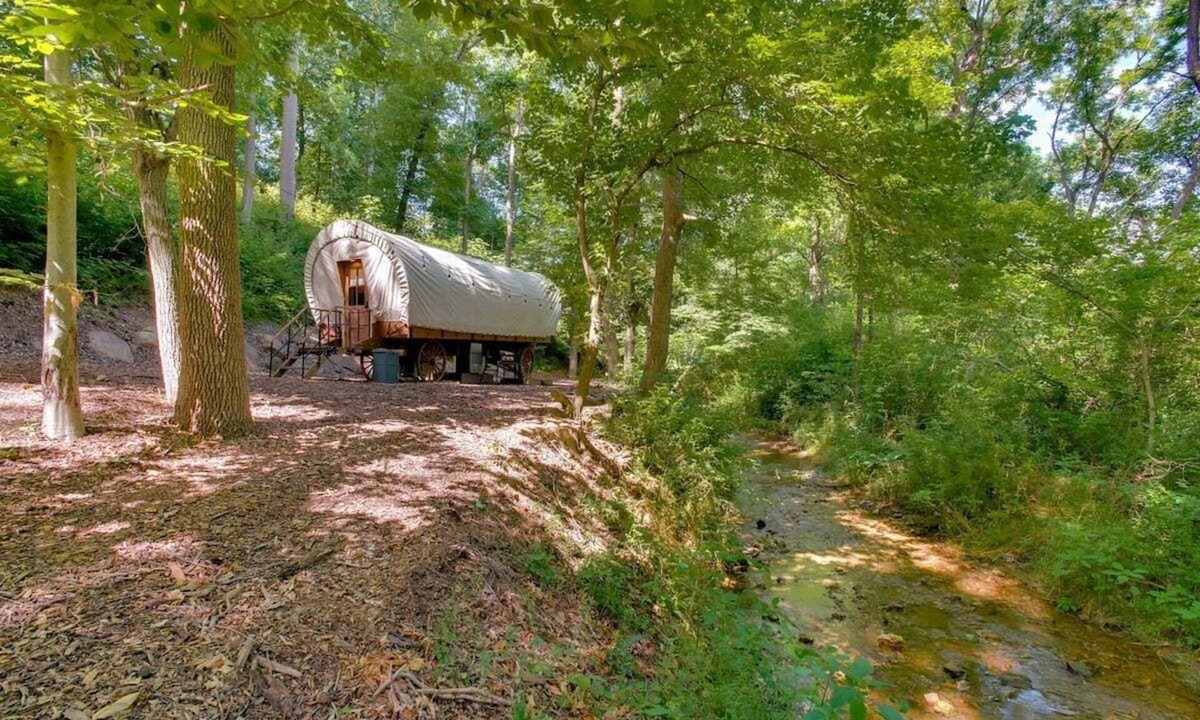 Strasburg RV Rental | Covered Wagon Camping along Creek, Sleeps 4