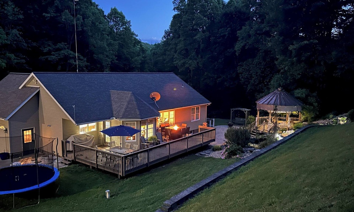 Killbuck House | Spacious home! Large deck, patio, waterfalls, koi pond, hot tub & massage chair!
