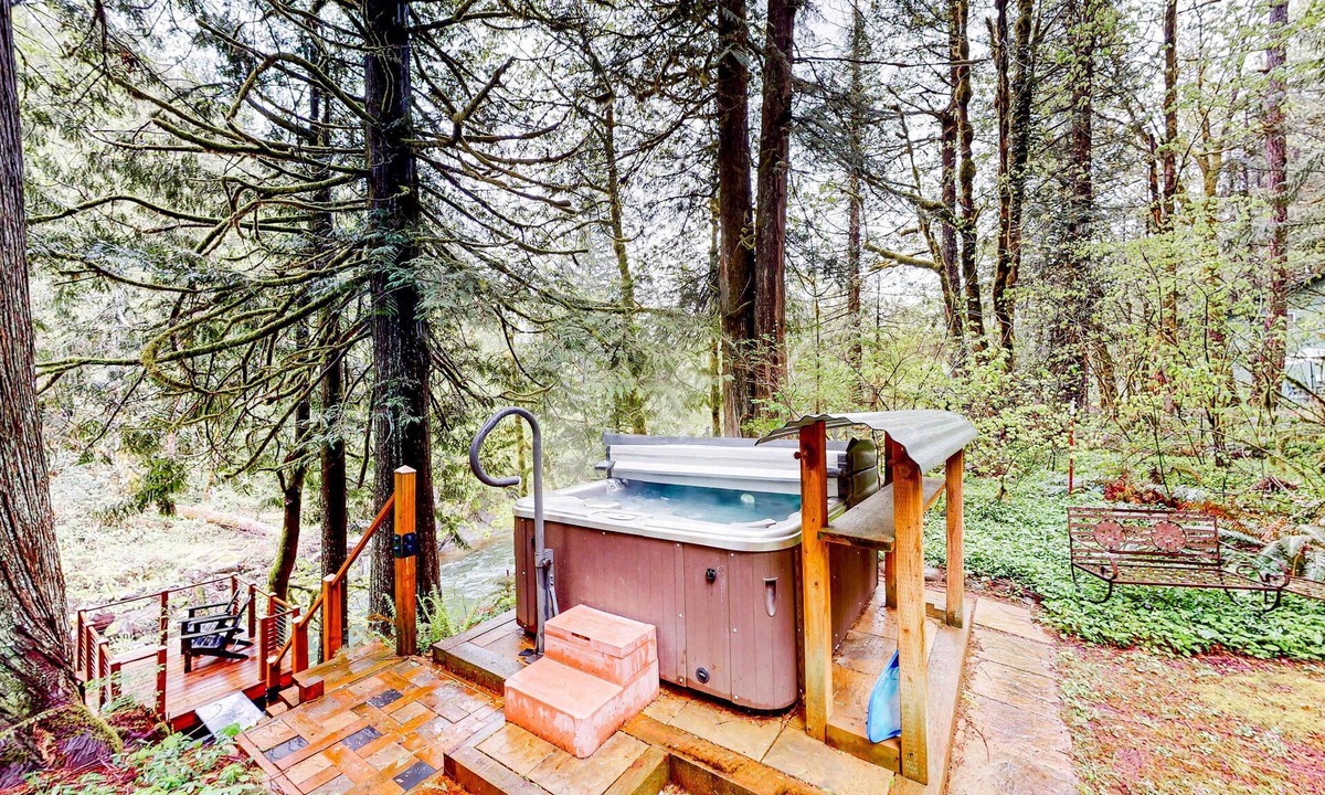 Marmot Apartment | Unwind in nature's embrace at a 1925 cabin with hot tub & river views