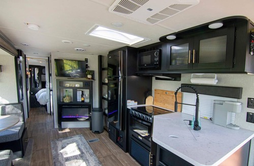 Talent House | 2 separate RV’s with queen-sized beds, dining area, and full kitchen.