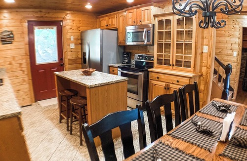 Elkton Cabin | 5 minutes from Massanutten resort - hot tub fire pit sleeps up to 10 riverfront