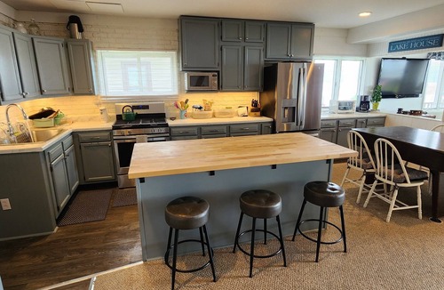Bemus Point House | Bemus Point lakefront family home with deck, dock, boat slip, sunroom with view