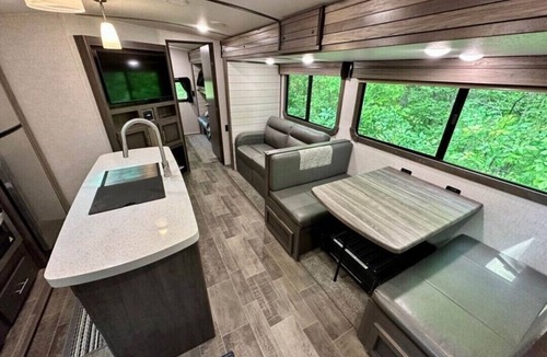 Lucas RV Rental | Black Fork River front fully functioning Camper