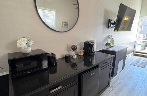 Osage Apartment | Bright & Stylish studio featuring an open layout, sleek finishes & fully furnished comfort.