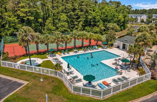 Sunset Beach Condo | Chasing Sunsets: Waterfront condo with pool, tennis, bikes & lagoon/golf views - near the beach