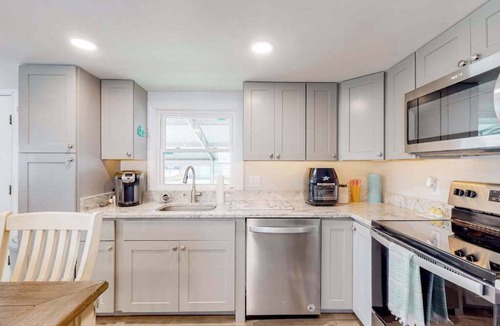 Montego Bay House | Comfortable home near beach with screened porch, pool, tennis, & mini-golf