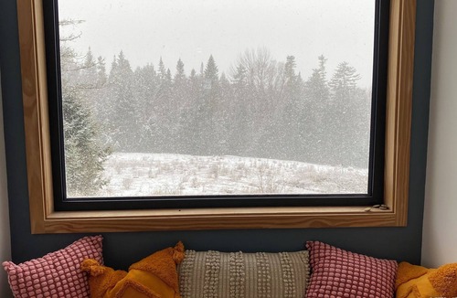 Rochester House | Contemporary shipping container home atop a scenic knoll in Rochester, Vermont.