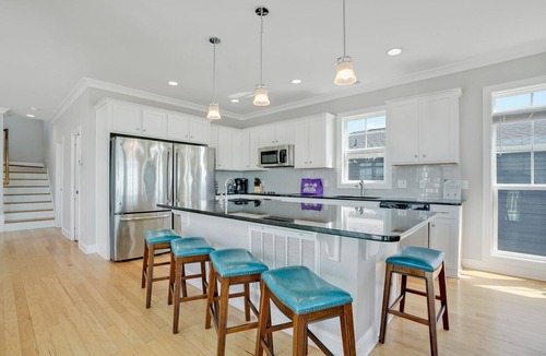 Long Beach House | Discover oceanfront bliss at 7th Heaven in Oak Island, NC—spacious 7BR, sleeps 24!