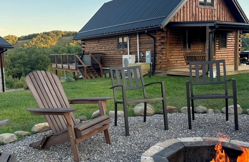 Swain House | Enjoy an updated classic log cabin with ski slope views from the hot tub.