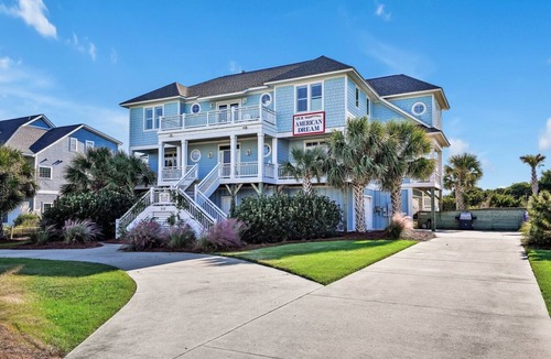 Caswell Beach House | Experience oceanfront luxury at 'Our American Dream' in Oak Island, NC, perfect for 19 guests!