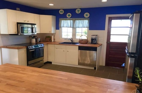 Ewell Cottage | IDLE HOUR, a tranquil 3 bedroom 1.5 bath cottage WITH DOCK & golf cart rental