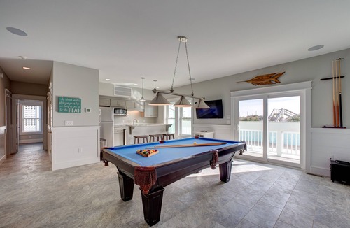 Avon House | Lovely beachfront home with hot tub, pool, game room, & central AC