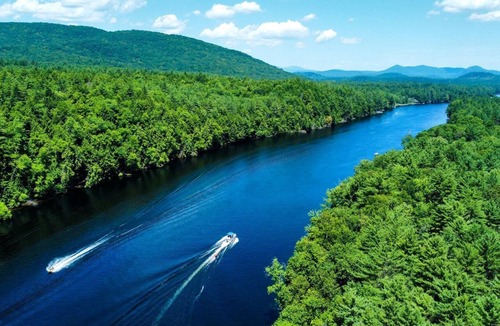 Corinth RV Rental | Luxury Group Safari Tent Complete with Firepit and Patio, Perfect for a Weekend Escape to the Adirondacks