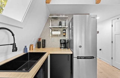 Great Cacapon Cabin | Modern Black A-frame retreat in the woods of Great Cacapon,WV - river access