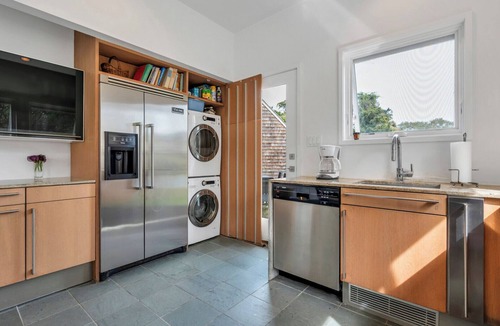Bridgehampton House | Modern Bridgehampton retreat w expansive yard, heated pool, close to town.
