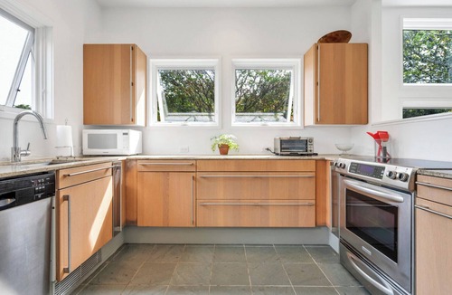 Bridgehampton House | Modern Bridgehampton retreat w expansive yard, heated pool, close to town.