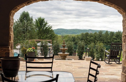 Wernersville House | Private 100-acre luxury estate for up to 30 guests with a resort-style pool, hot tub, game room, sports court, wellness spa, and sweeping sunset views—perfect for reunions, retreats, and unforgettable group stays.