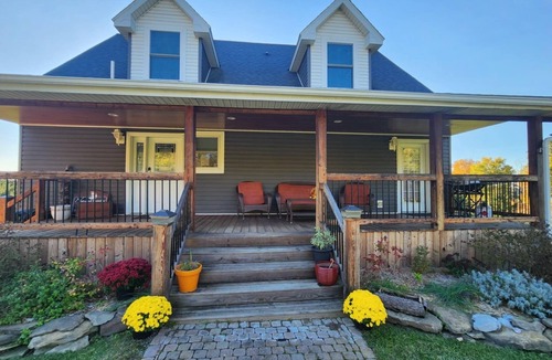 Conesus House | Private Finger Lakes Getaway with a Pool, Hot Tub, and Sauna, timber frame porch