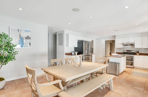 Tuckahoe House | Resort-style Southampton retreat with heated pool, chic interiors, and.
