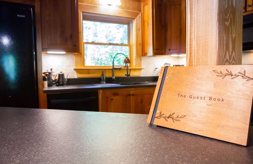 Dawsonville Cabin | Riverfront Log Cabin with Treetop Views near Dahlonega- Hot Tub, Firepits, more!