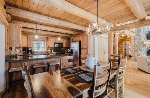 Three Rivers House | Riverfront log cabin style home with full kitchen, deck, washer & dryer and WIFI