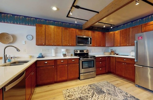 East Village at Copper House | Stylish townhouse with mountain and golf views, shared hot tub, and balconies
