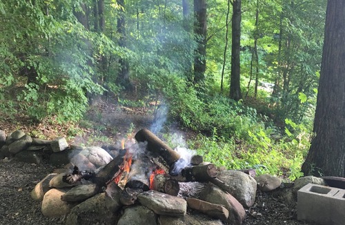 Bliss RV Rental | Woodsy campground , trails, pool, hot tub, showers , beach , play ground, movies