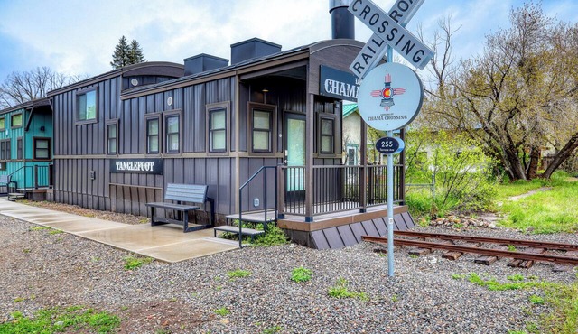 Chama Crossing - Tiny Train Next to Railroad in Chama