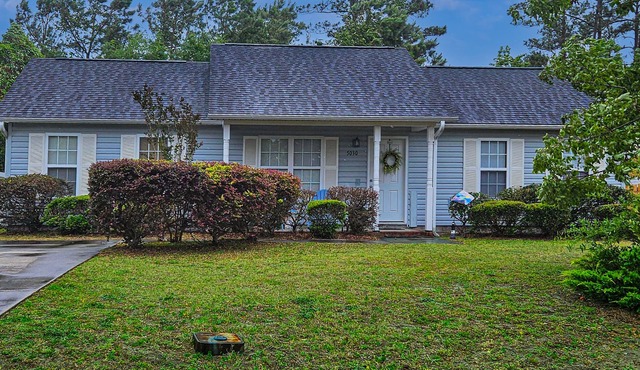 Charming dog-friendly home with pool access, screened patio, cozy deck & W/D
