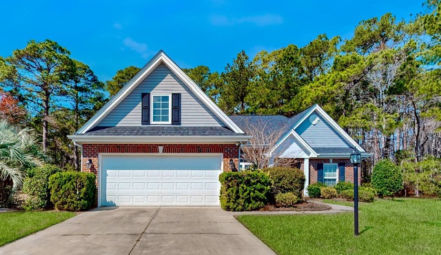Dog-friendly coastal home with lovely patio, pool, & games - near beaches & golf
