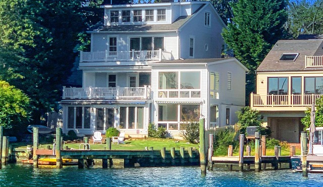 Dog-friendly riverfront home with dock, 2 balconies, waterside patio, & grill