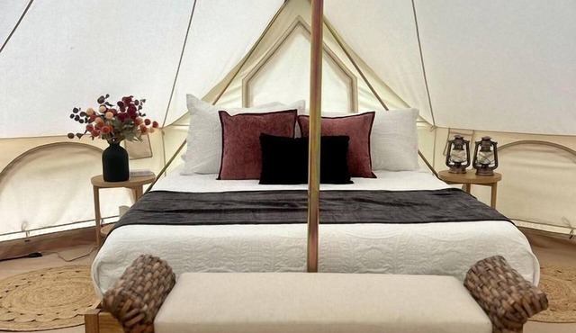 Enchanting Mountain Glamping Tents with Elevated Decks and Fire Pit Near Gentry, AR