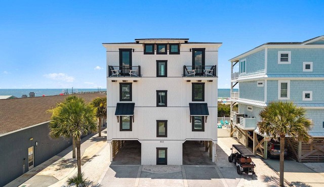 Experience luxury at 'How Suite It Is'—14-bedroom oceanfront retreat in Oak Island!