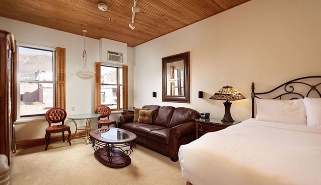 Independence Square Unit 306 | Hotel Room with Large Sitting Area & Wet Bar