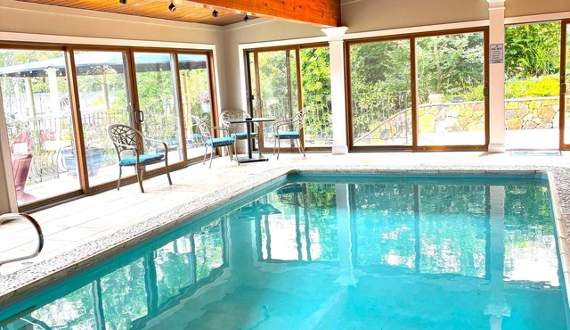 Indoor/Outdoor waterfront oasis with indoor heated pool awaits you in Eastport!