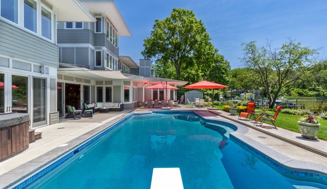 Lakefront home with private pool, hot tub, outdoor space, central AC, & W/D