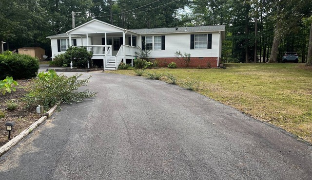 Relax at this Golf Community House with nearby water access!