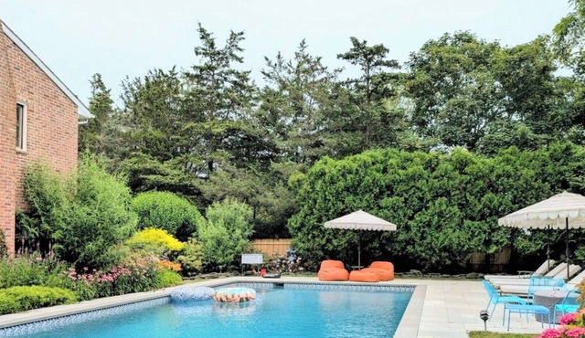 Timeless Shingled Hampton Bays Retreat with Private Heated Pool, An.