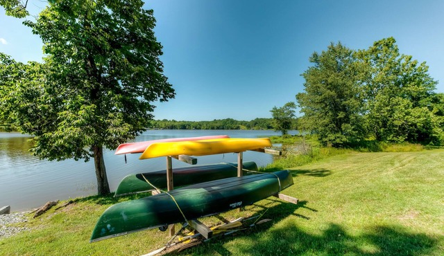 Two-story, lakefront getaway with dock, beach, grill, 2 kayaks, 2 canoes, AC